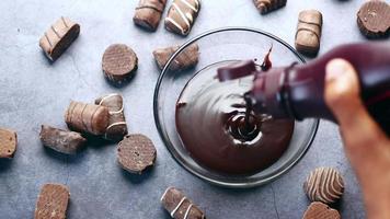 Dark chocolate cream in a bowl on white video