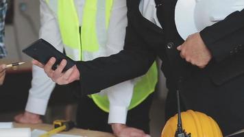 architect man working with laptop and blueprints,engineer inspection in workplace for architectural plan,sketching a construction project ,selective focus,Business concept vintage color video