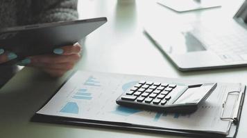 Financial Business team present. Business man hands hold documents with financial statistic stock photo, discussion, and analysis report data the charts and graphs. Finance Financial concept video