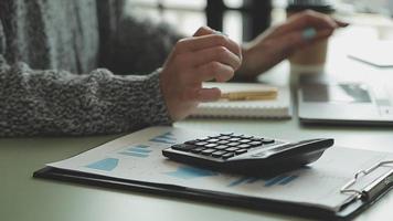 Financial Business team present. Business man hands hold documents with financial statistic stock photo, discussion, and analysis report data the charts and graphs. Finance Financial concept video