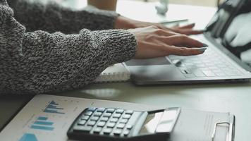 Financial Business team present. Business man hands hold documents with financial statistic stock photo, discussion, and analysis report data the charts and graphs. Finance Financial concept video