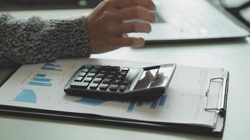 Financial Business team present. Business man hands hold documents with financial statistic stock photo, discussion, and analysis report data the charts and graphs. Finance Financial concept video