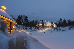 Lapland Elf buildings while snowing photo