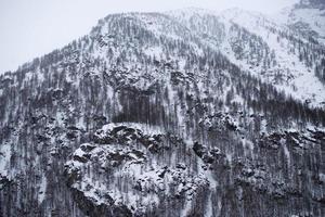 mountain while snowing photo