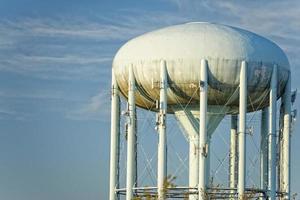 A water tower in the deep blue sky photo