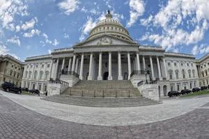 Full Washington DC Capitol on cloudy sky photo