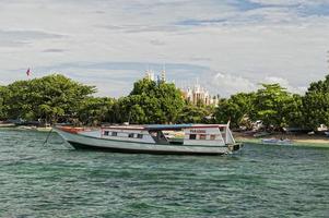 A boat on the reef in tropical paradise photo