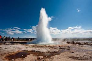 Geyser in Iceland while blowing water photo