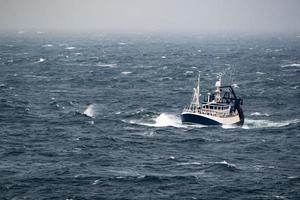 Ship in the tempest in north sea photo