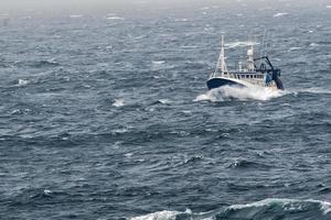 Ship in the tempest in north sea photo