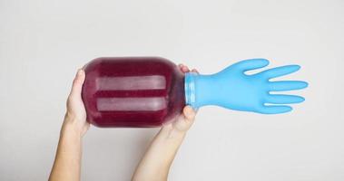 red wine fermentation at home with a rubber glove on a jar video