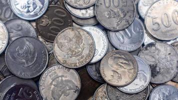 pile of rupiah coins as background photo