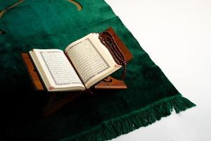 old Quran book on a table photo