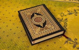 Quran cover on traditional Arabic carpet photo