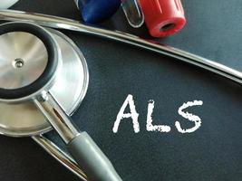 ALS or Amyotrophic lateral sclerosis a type of motor neuron disease, medical conceptual image, black background. photo