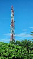 Communications Tower with Beautiful Blue Sky Telecommunication Network Signal View photo