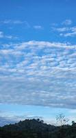 White Soft Fluffy Clouds on Blue Beautiful Sky. White Puffy Cloudscape. Cumulus Cloud Texture Background. Sky on Sunny Day. Pure White Clouds Beautiful Sky photo