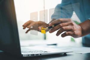 Concept of online document management technology. Businesspeople manage corporate databases through cloud, cyberspace technology and large, paperless archives of important, file and online storage. photo
