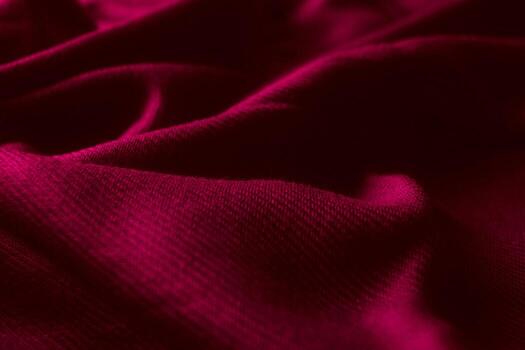 Fabric texture background of magenta color Viva Magenta. Close up of clothes as wallpaper. photo