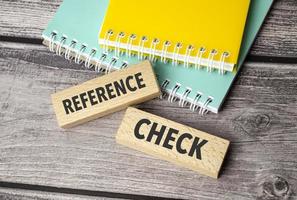 REFERENCE CHECKS symbol. Concept words content is king on wooden blocks. photo