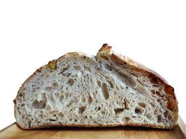 Close up Side view inside of baked brown sourdough on the wooden plate, natural yeast, artisan, cutout, isolated, transparent, with clipping path
