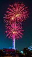 fireworks over the temple in the dark sky photo