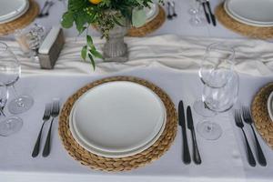 Festive table at the wedding party decorated with lemon arrangements photo