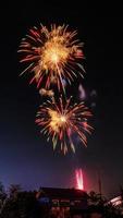 fireworks over the temple in the dark sky photo