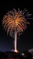 fireworks over the temple in the dark sky photo