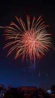 fireworks over the temple in the dark sky photo