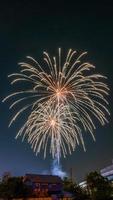 fireworks over the temple in the dark sky photo