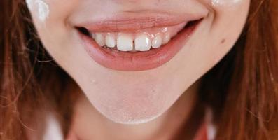 close-up of beautiful female smile photo