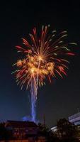 fireworks over the temple in the dark sky photo