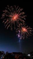 fireworks over the temple in the dark sky photo