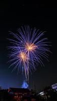 fireworks over the temple in the dark sky photo