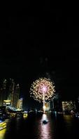 fireworks on the river in the dark sky photo