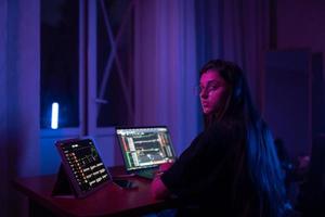 Attractive young woman working in home at night. photo