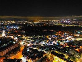 Illuminated Night View of Da Lat City, Vietnam A Captivating Display of City Lights against the Dark Starry Sky photo