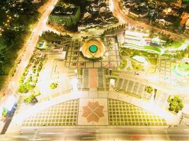 Enchanting Nighttime View of Forest Park Square in Da Lat City, Vietnam. A Dazzling Display of Colorful Lights and Lush Greenery photo