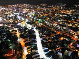 Illuminated Night View of Da Lat City, Vietnam A Captivating Display of City Lights against the Dark Starry Sky photo