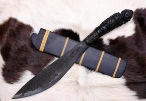 Amulet knife of Native Thailand knife with ebony wood sheath is handmade in Thailand for protection luckily photo