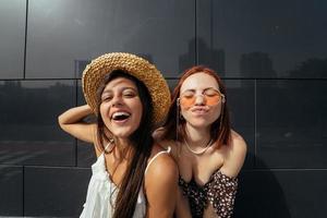 Two attractive young women fooling around in fresh air. photo