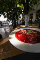 close up view of yummy Borscht in a white plate photo