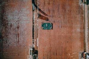 Brick. Texture of painted old dark brown and red brick walls, rough rusty blocks, horizontal architecture photo