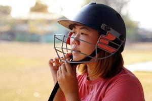 Cricket player wearing black cricket helmet before going to the field for training. soft and selective focus. photo