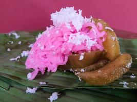 Traditional Jepara food, namely Gethuk putu mayang mixed gendar which is given grated coconut. photo