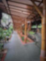 Defocused blurred photo of the exterior of a garden belonging to a typical Sundanese restaurant