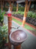 Defocused blurred photo of the exterior of a garden belonging to a typical Sundanese restaurant