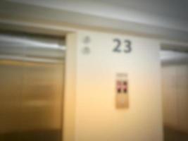 Defocused blurred photo of elevator corridor on floor 23 in a high rise building.