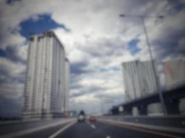 Defocused blurred photo of vehicles and scenery on the Muhammad Bin Zayed toll road